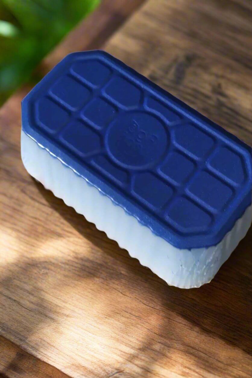 Daisy & Spring Meadows artisan wax melt loaf in blue and white on wooden surface, perfect for scenting any space.