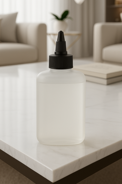 White bottle with black cap on a marble surface in a living room setting